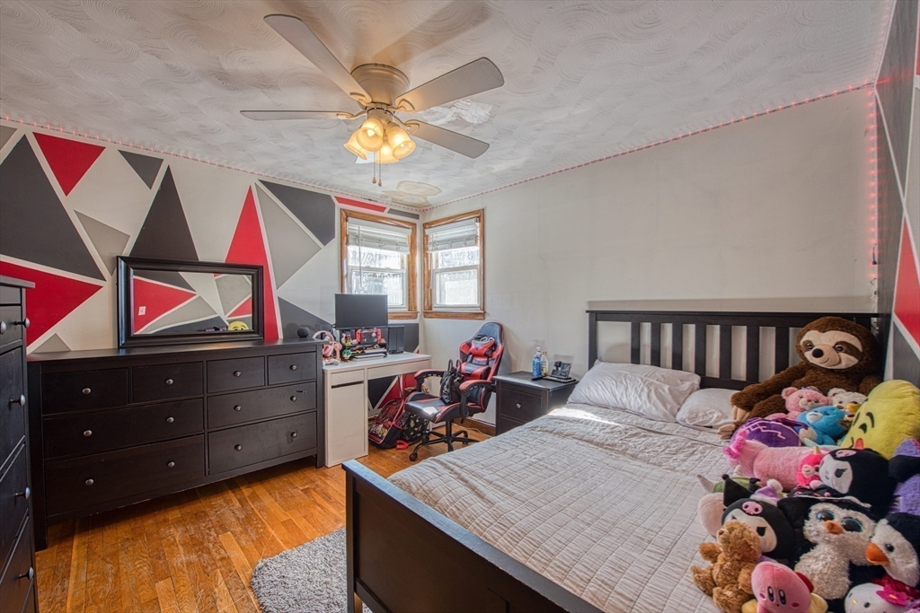12 Brewster Road Randolph, MA 02368 - Photo 12 of 27 a bed room with a bed and a dresser