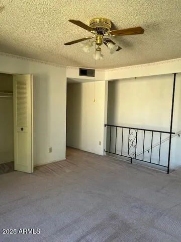 an empty room with fan