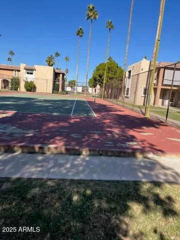 a view of a house with swimming pool and sitting area