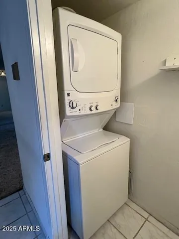 a white toilet sitting next to a shower