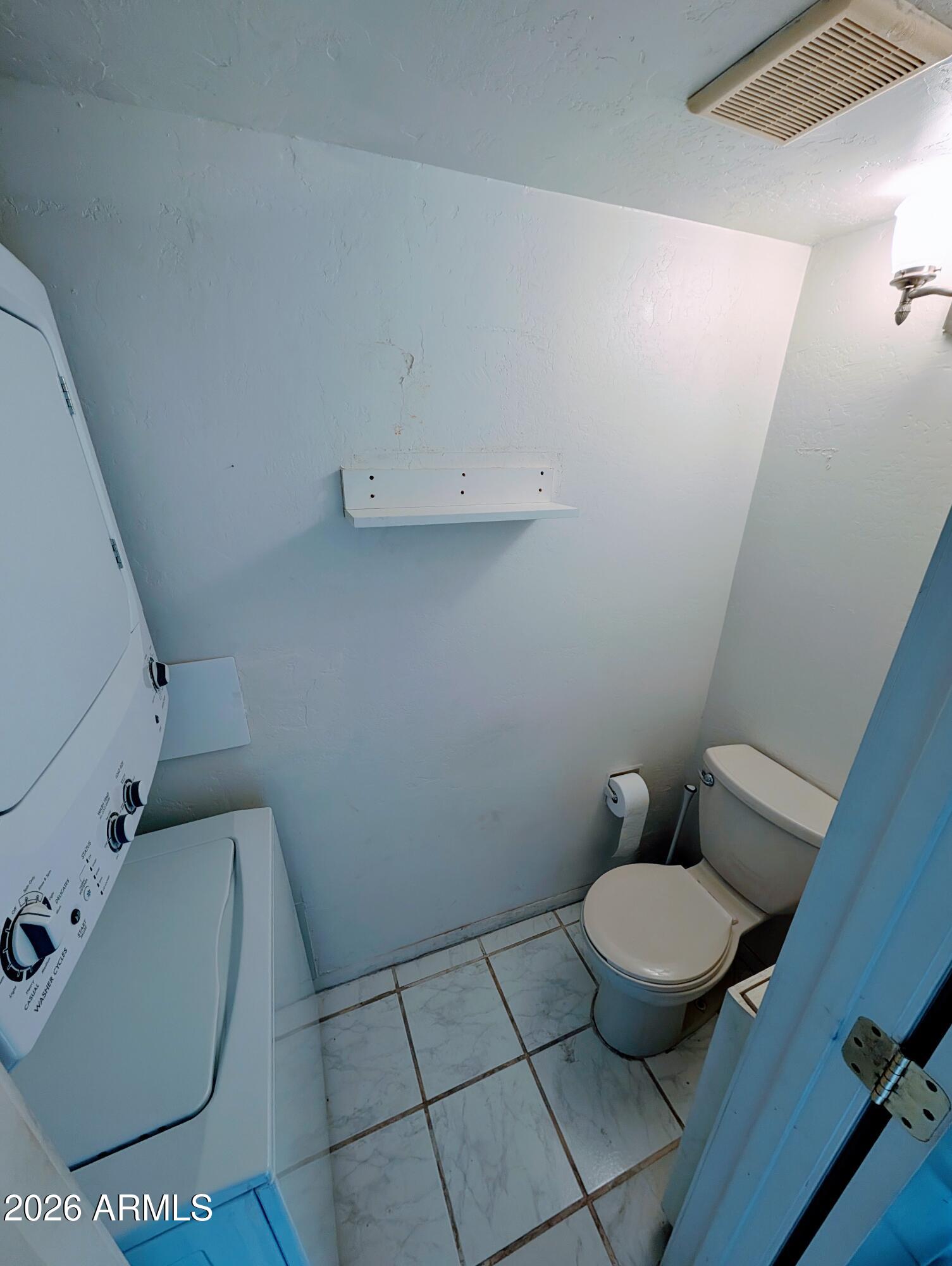7126 North 19th Avenue, Unit 118 Phoenix, AZ 85021 - Photo 10 of 25 Half bath and laundry