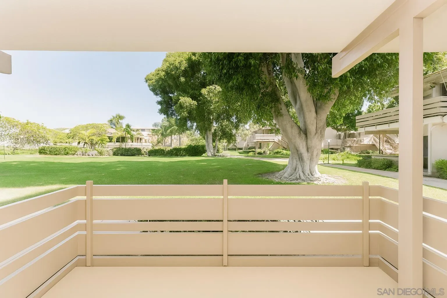 4032 Valeta Street, Unit 319 San Diego, CA 92110 - Photo 11 of 17 a view of a floor to ceiling window and a yard