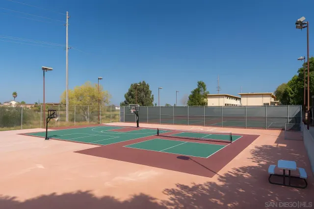 a swimming pool with some trees in the background