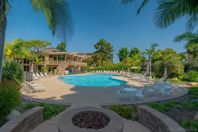 a view of a swimming pool with a patio