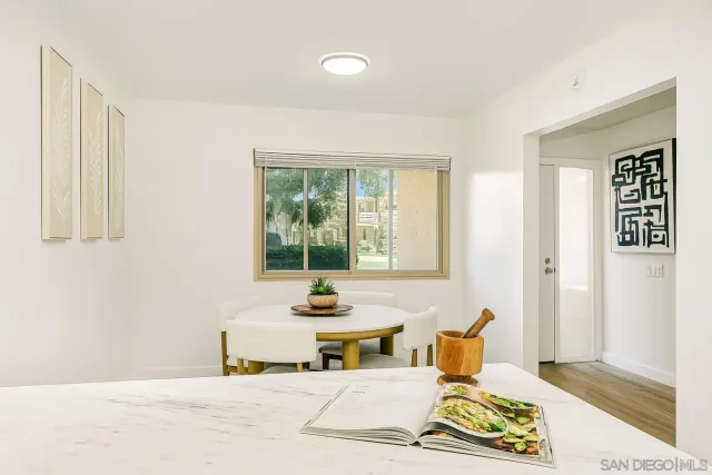 a living room with furniture and next to a window