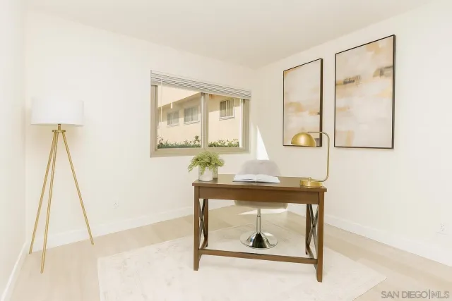 a room with a table and mirror