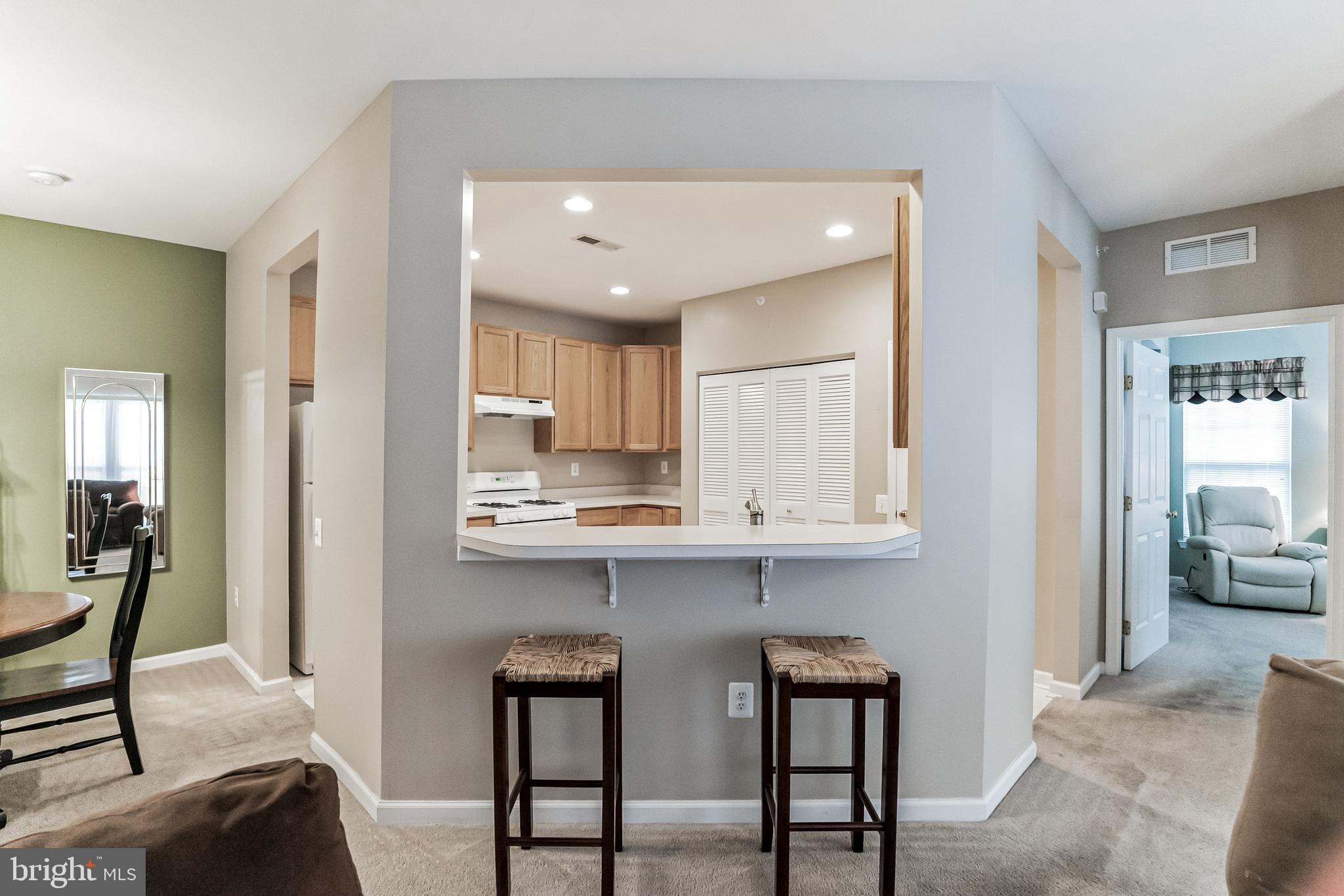 200 Beech Boulevard, Unit 104 Warrington, PA 18976 - Photo 12 of 30 a view of a kitchen and dining room