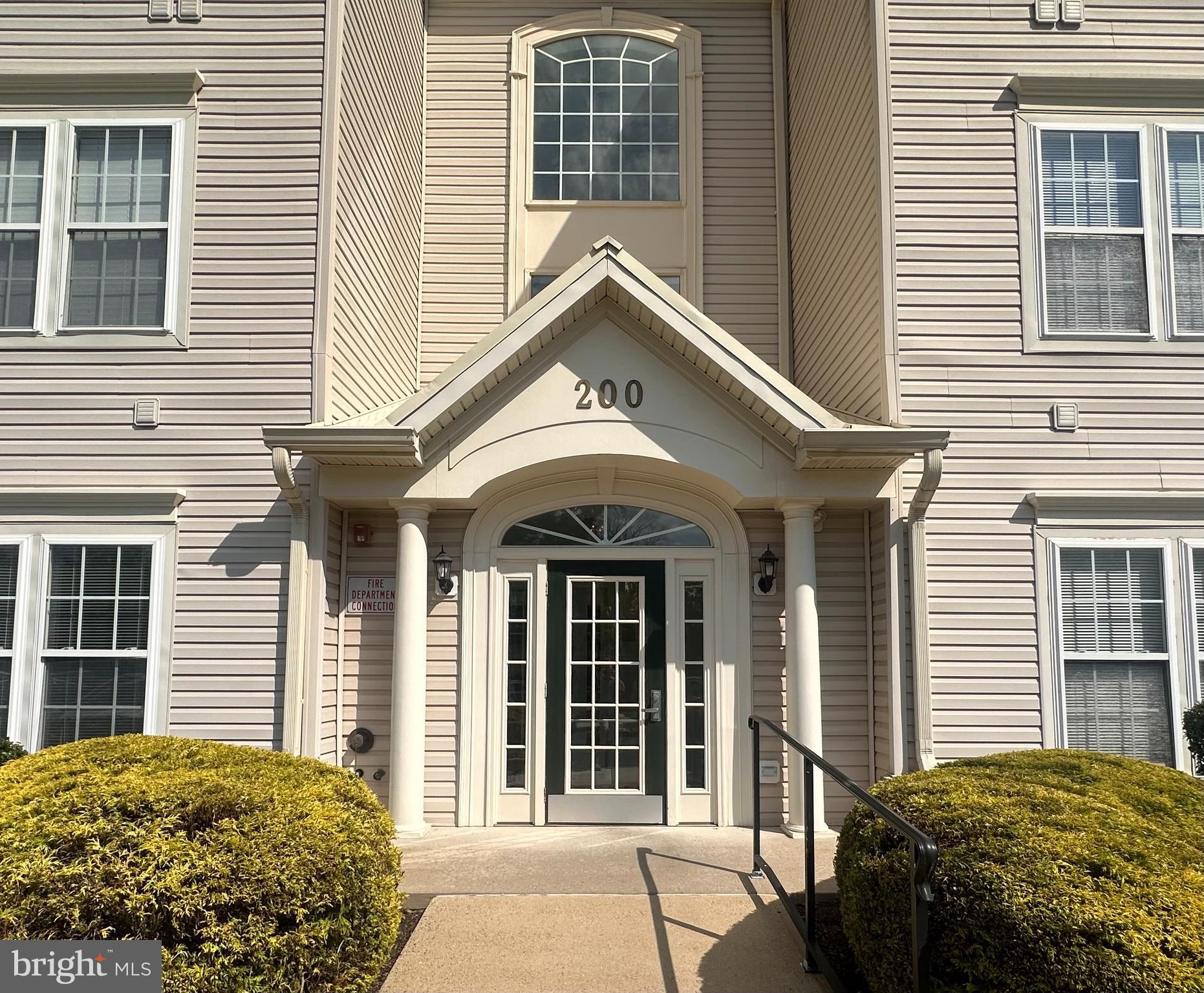 200 Beech Boulevard, Unit 104 Warrington, PA 18976 - Photo 2 of 30 a front view of a house with a yard