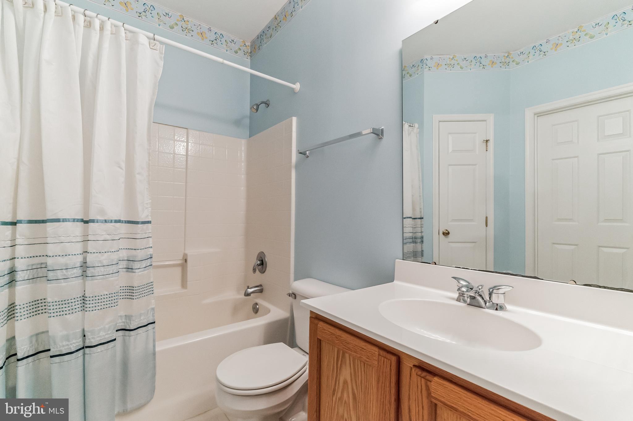 200 Beech Boulevard, Unit 104 Warrington, PA 18976 - Photo 23 of 30 a bathroom with a sink a toilet and shower