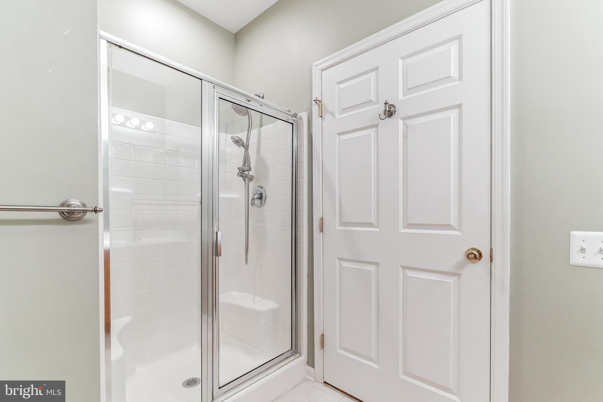 200 Beech Boulevard, Unit 104 Warrington, PA 18976 - Photo 28 of 30 a bathroom with a glass shower door