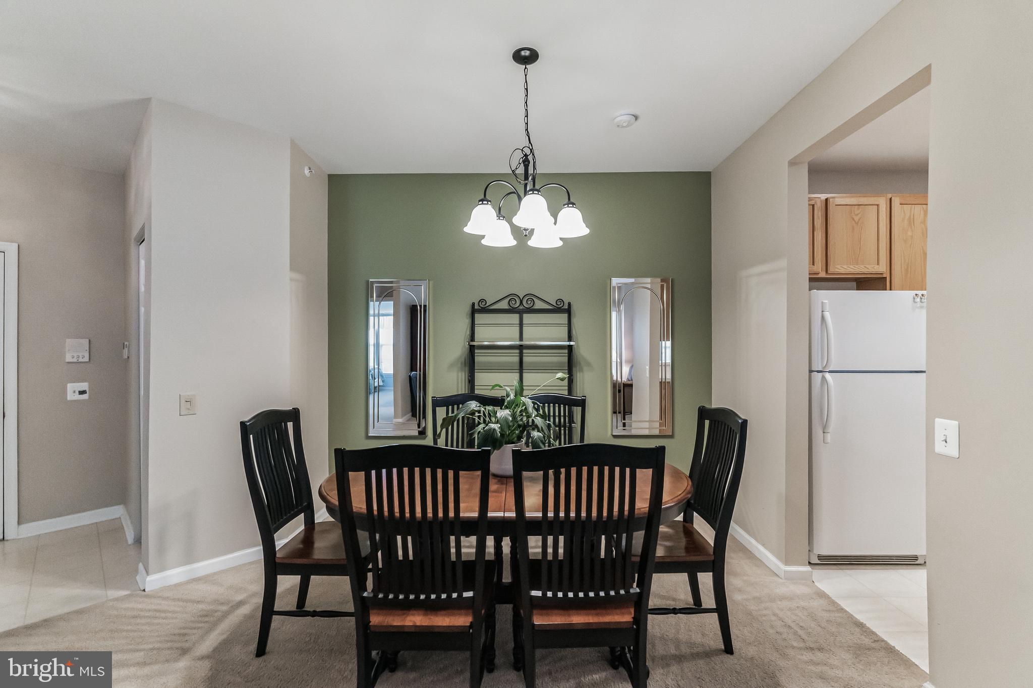 200 Beech Boulevard, Unit 104 Warrington, PA 18976 - Photo 10 of 30 a view of a dining room with furniture and window