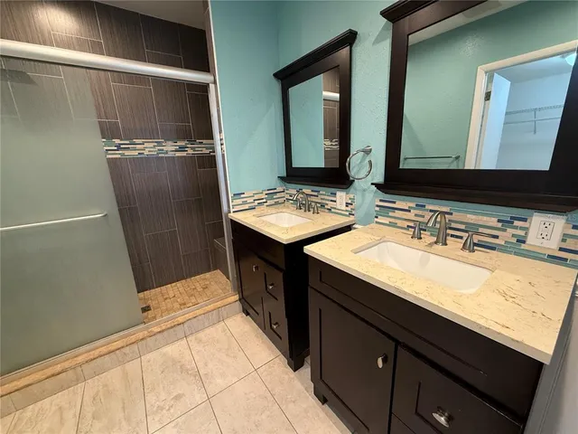 a view of a backyard with a tree