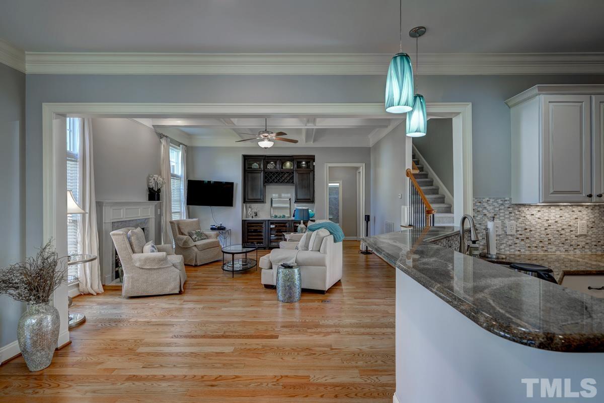 2724 Peachleaf Street Raleigh, NC 27614 - Photo 12 of 45 a living room with furniture and a fireplace