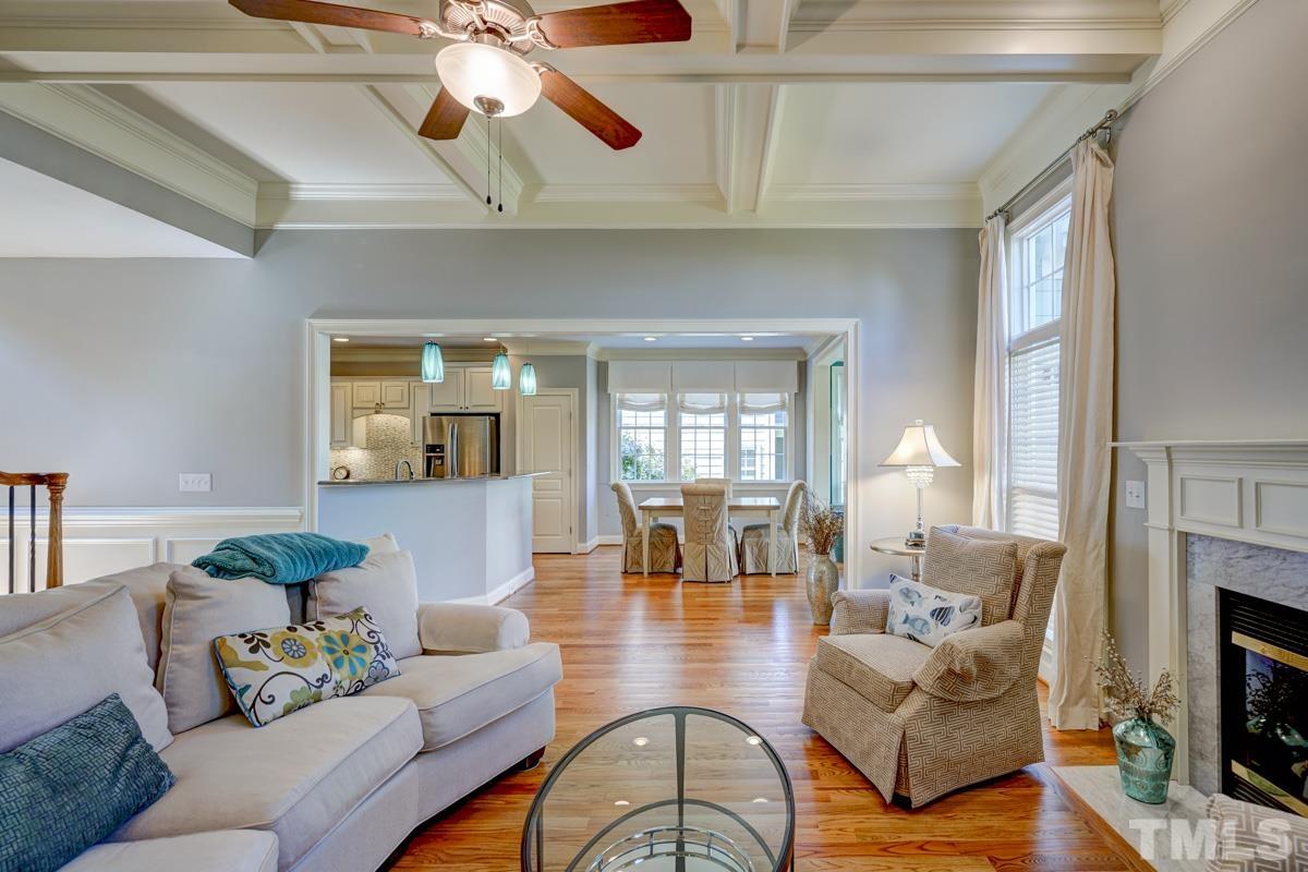 2724 Peachleaf Street Raleigh, NC 27614 - Photo 21 of 45 a living room with fireplace furniture and a wooden floor