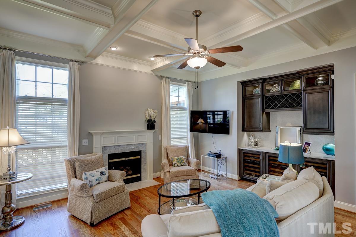 2724 Peachleaf Street Raleigh, NC 27614 - Photo 23 of 45 a living room with furniture a fireplace and a flat screen tv