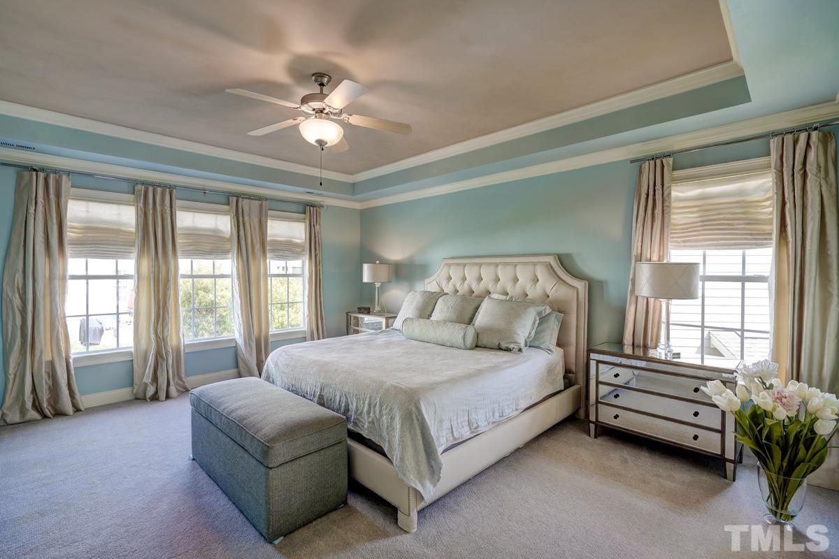2724 Peachleaf Street Raleigh, NC 27614 - Photo 26 of 45 a bedroom with a bed couch and windows