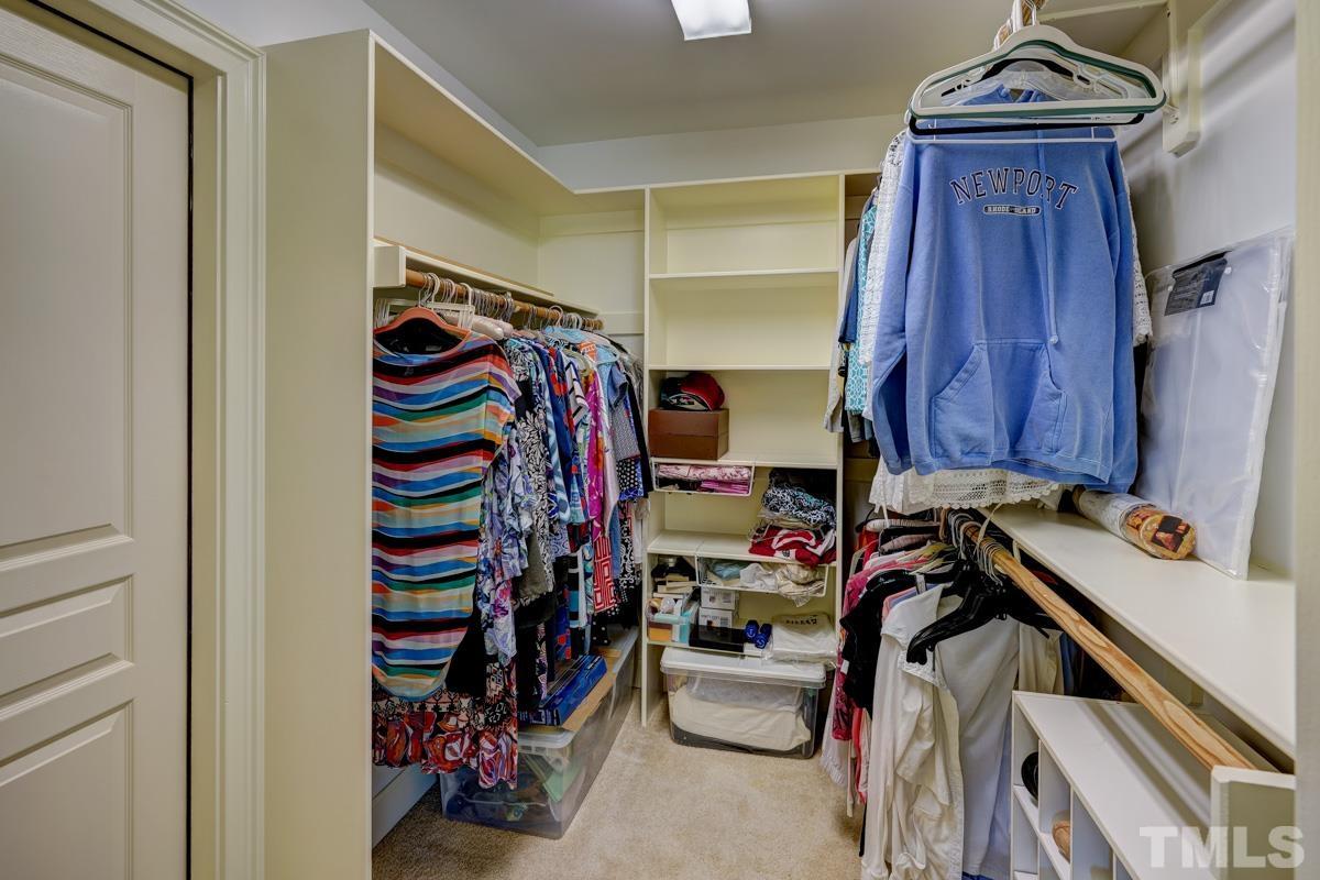 2724 Peachleaf Street Raleigh, NC 27614 - Photo 32 of 45 a view of walk in closet with clothes and shoes
