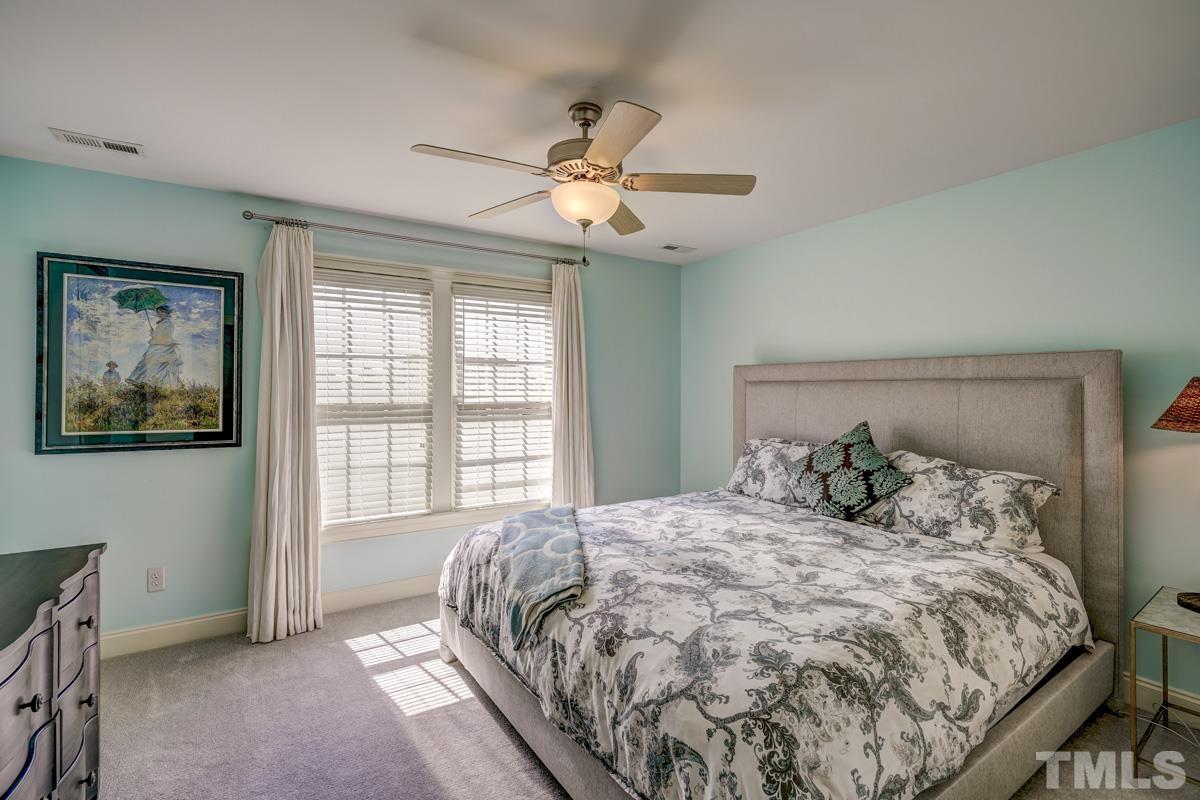 2724 Peachleaf Street Raleigh, NC 27614 - Photo 35 of 45 a bedroom with a large bed and a window