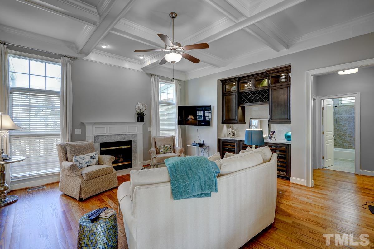 2724 Peachleaf Street Raleigh, NC 27614 - Photo 8 of 45 a living room with furniture and a fireplace