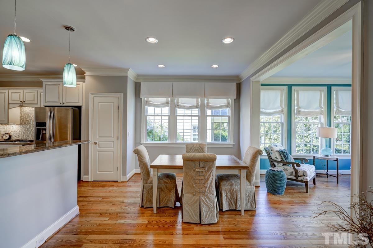 2724 Peachleaf Street Raleigh, NC 27614 - Photo 9 of 45 a view of a dining room with furniture window and wooden floor