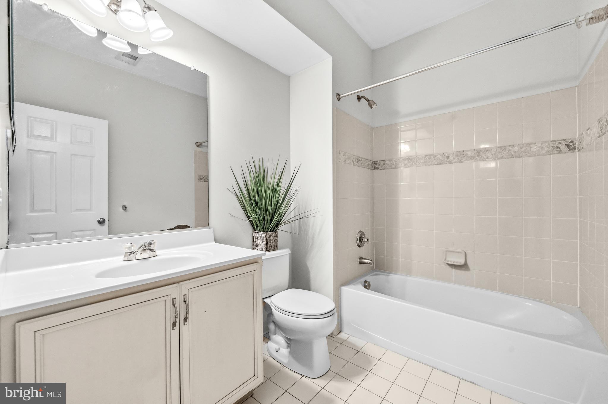 25154 Monteith Terrace Chantilly, VA 20152 - Photo 24 of 40 a bathroom with a sink a toilet and a bathtub