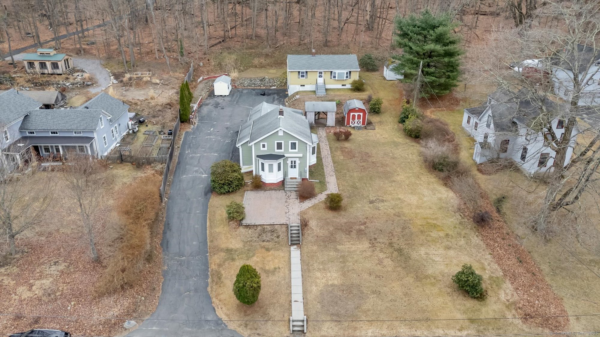 an aerial view of residential house with outdoor space