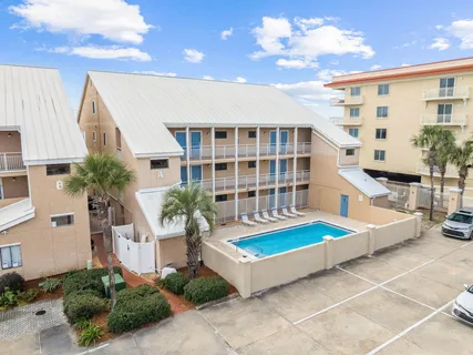 a view of a swimming pool with seating area