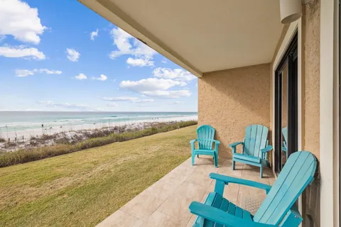 a view of a dining room with furniture and a flat screen tv
