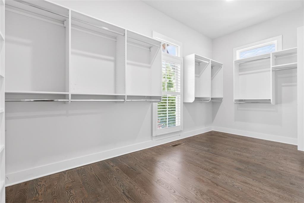 3528 North Bogan Road Buford, GA 30519 - Photo 32 of 79 an empty room with wooden floor and windows