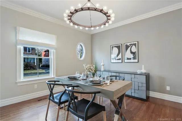 a view of a dining room with furniture and wooden floor