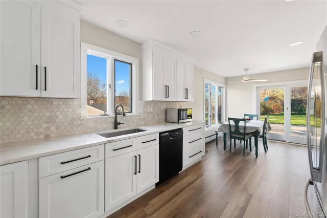 a kitchen with a sink and cabinets