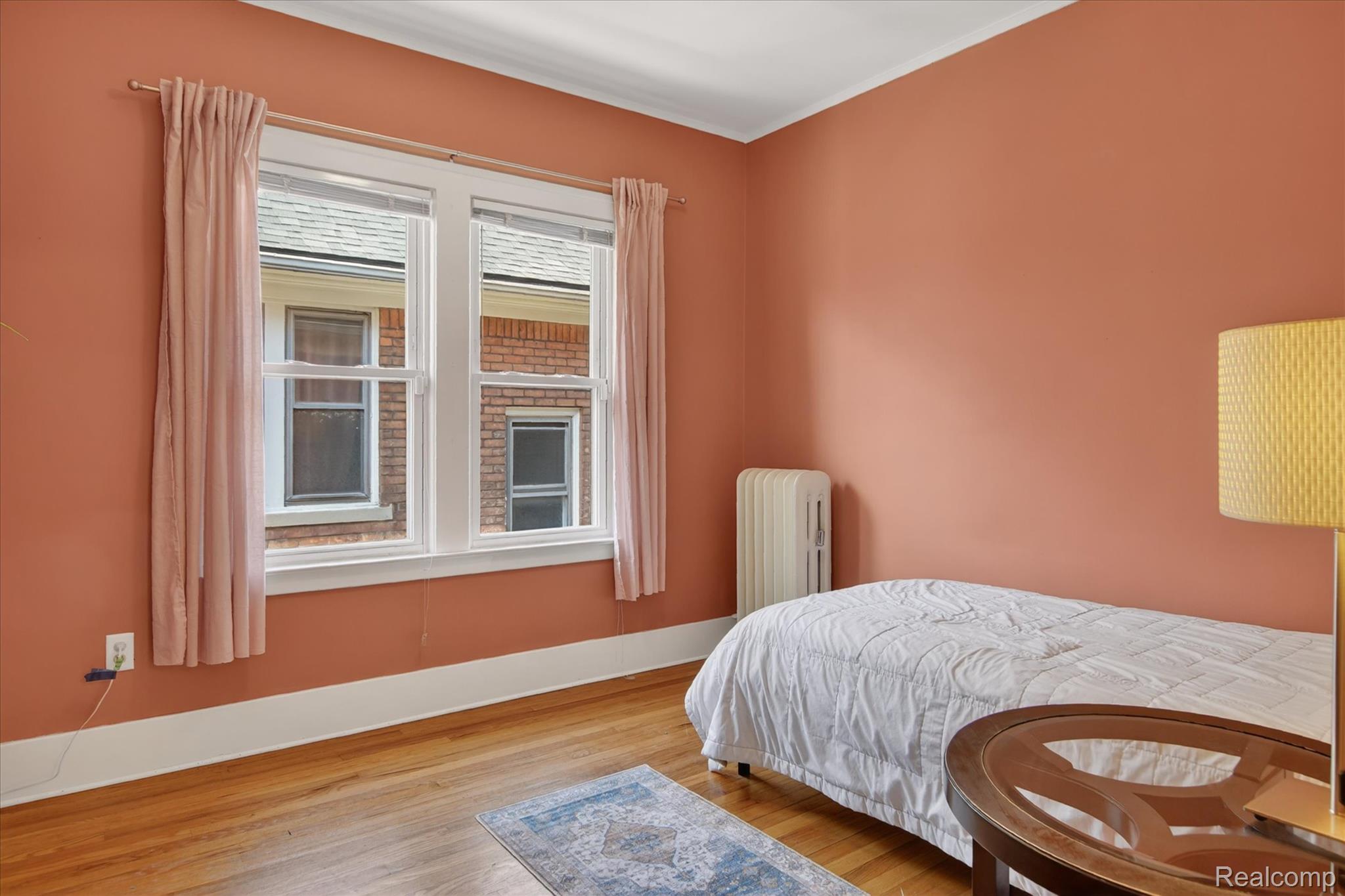 925 Nottingham Road Grosse Pointe, MI 48230 - Photo 22 of 46 Bedroom with light wood finished floors and radiator heating unit