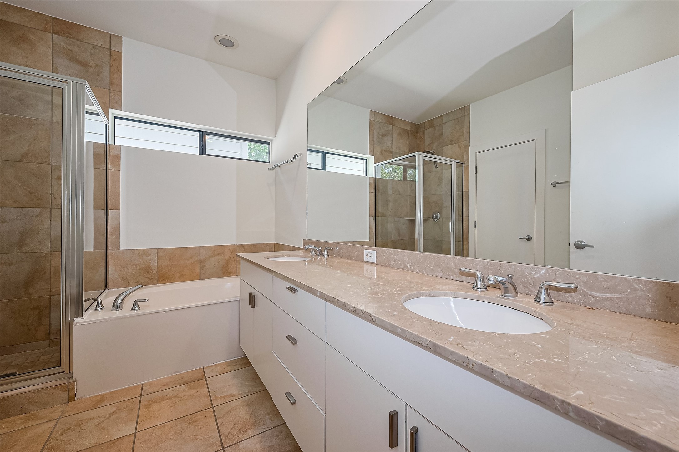 4331 Eigel Street Houston, TX 77007 - Photo 28 of 38 a bathroom with a granite countertop sink mirror bathtub and shower
