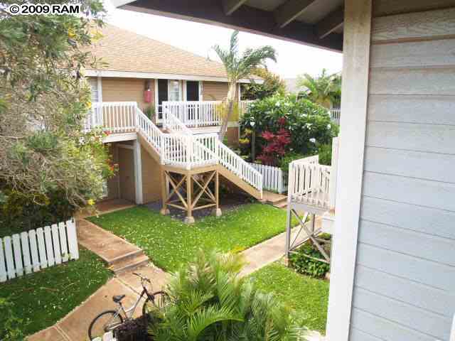 140 Uwapo Road, Unit 50202 Kihei, HI 96753 - Photo 1 of 14 a view of a house with backyard and porch