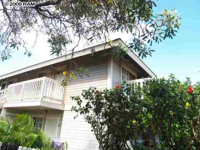140 Uwapo Road, Unit 50202 Kihei, HI 96753 - Photo 14 of 14 a view of a house with a small yard