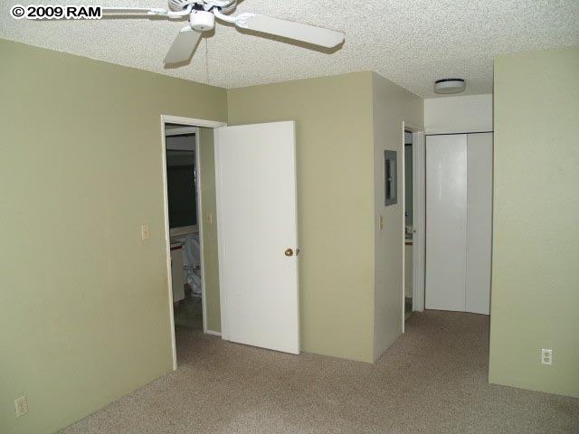 140 Uwapo Road, Unit 50202 Kihei, HI 96753 - Photo 9 of 14 a view of a room with a ceiling fan
