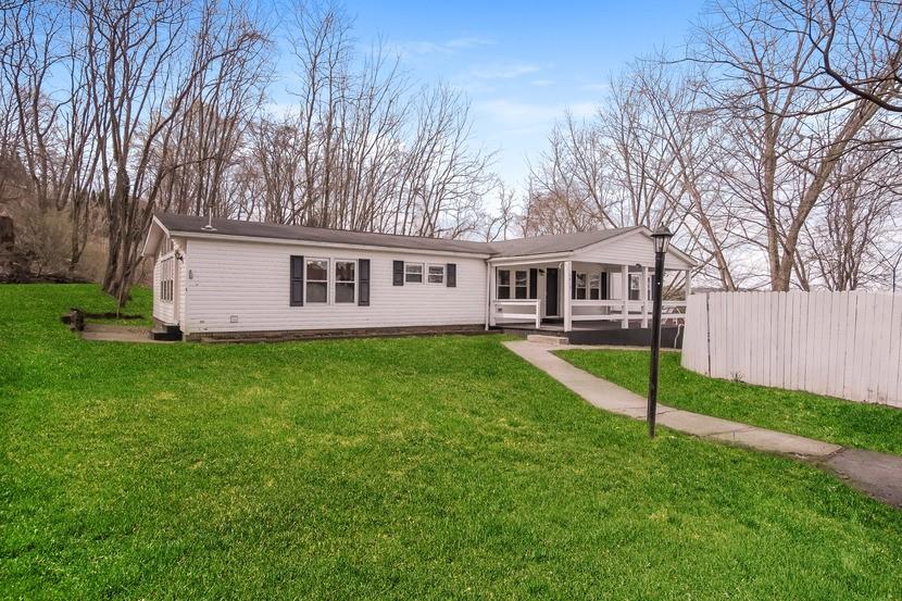 1413 Wimpole Street Aliquippa, PA 15001 - Photo 2 of 15 a view of a house with a yard and sitting area