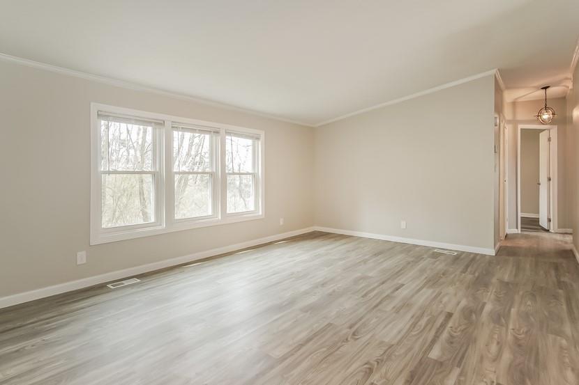 1413 Wimpole Street Aliquippa, PA 15001 - Photo 4 of 15 an empty room with wooden floor and windows