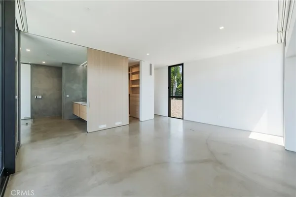 a large bathroom with a double vanity sink a toilet and shower