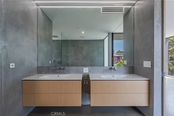 a bathroom with a glass door shower