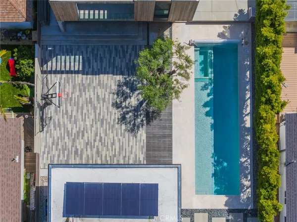 an aerial view of a house with a yard and a garage