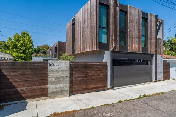 an aerial view of a house with outdoor space
