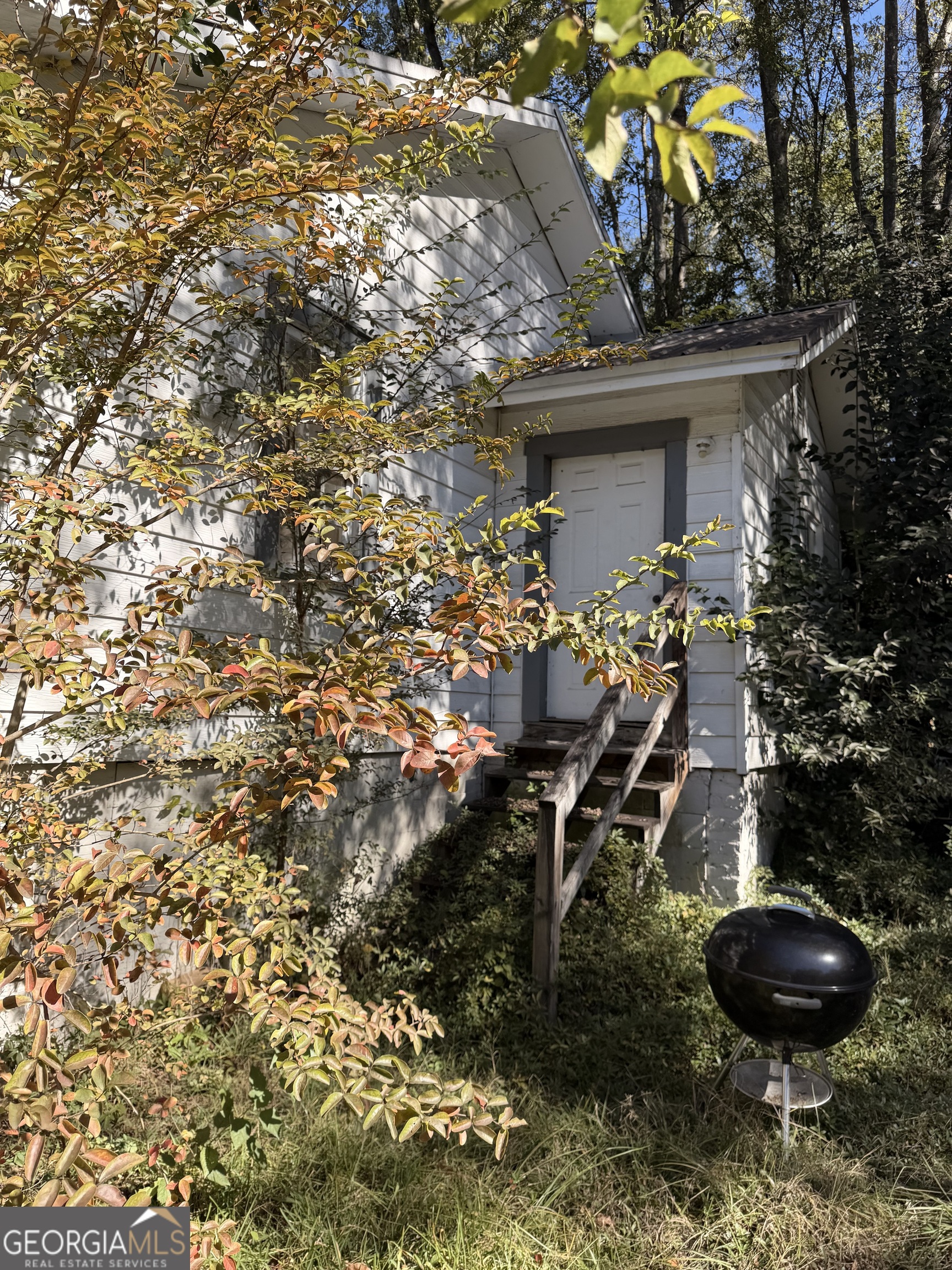 856 Grady Street Macon, GA 31206 - Photo 17 of 23 a view of house with a backyard and a tree