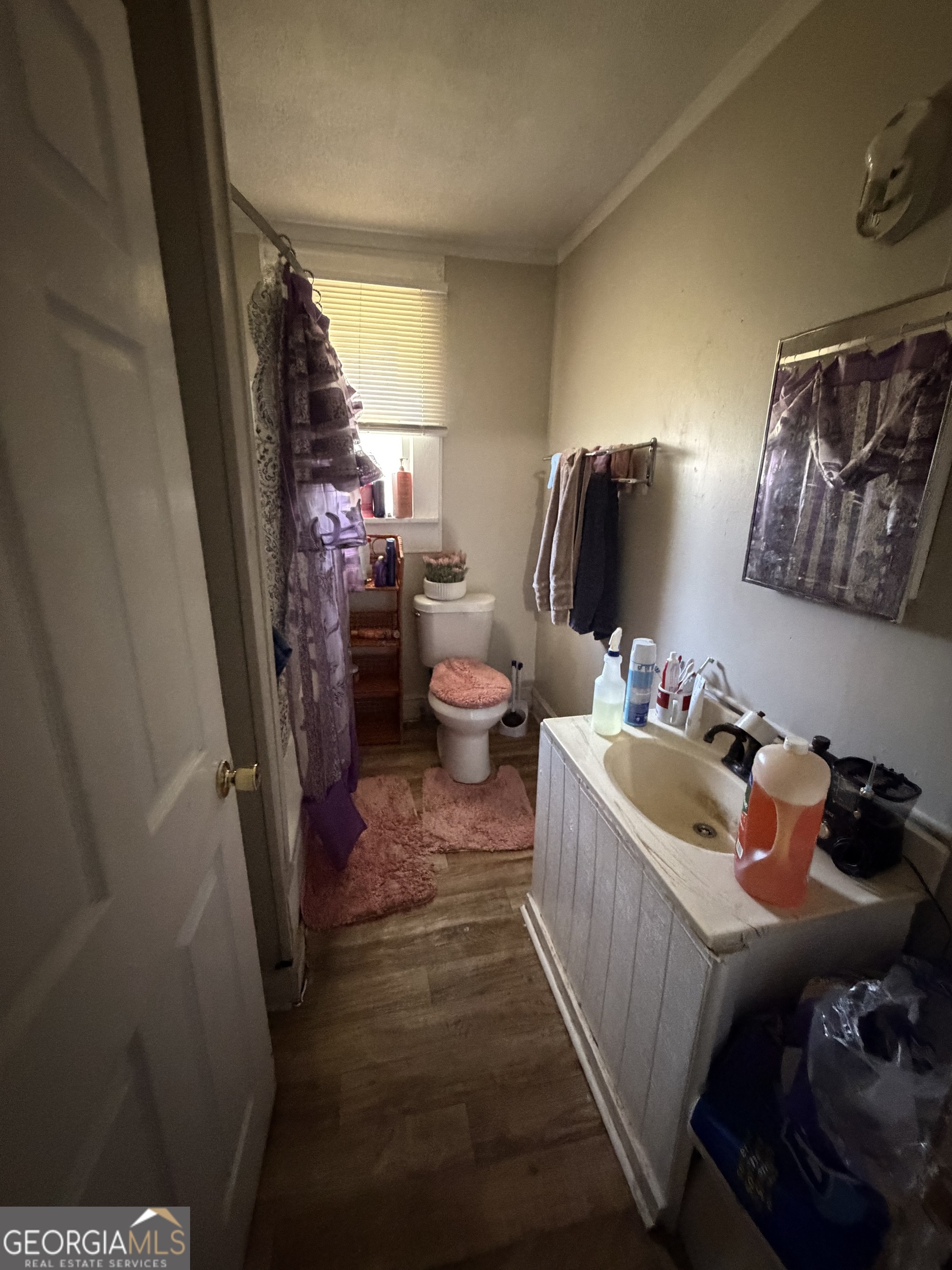 856 Grady Street Macon, GA 31206 - Photo 10 of 23 a bedroom with bed and a mirror