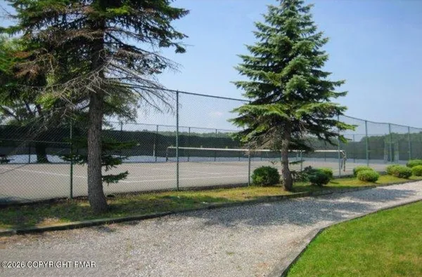 a view of a swimming pool with a lawn chairs