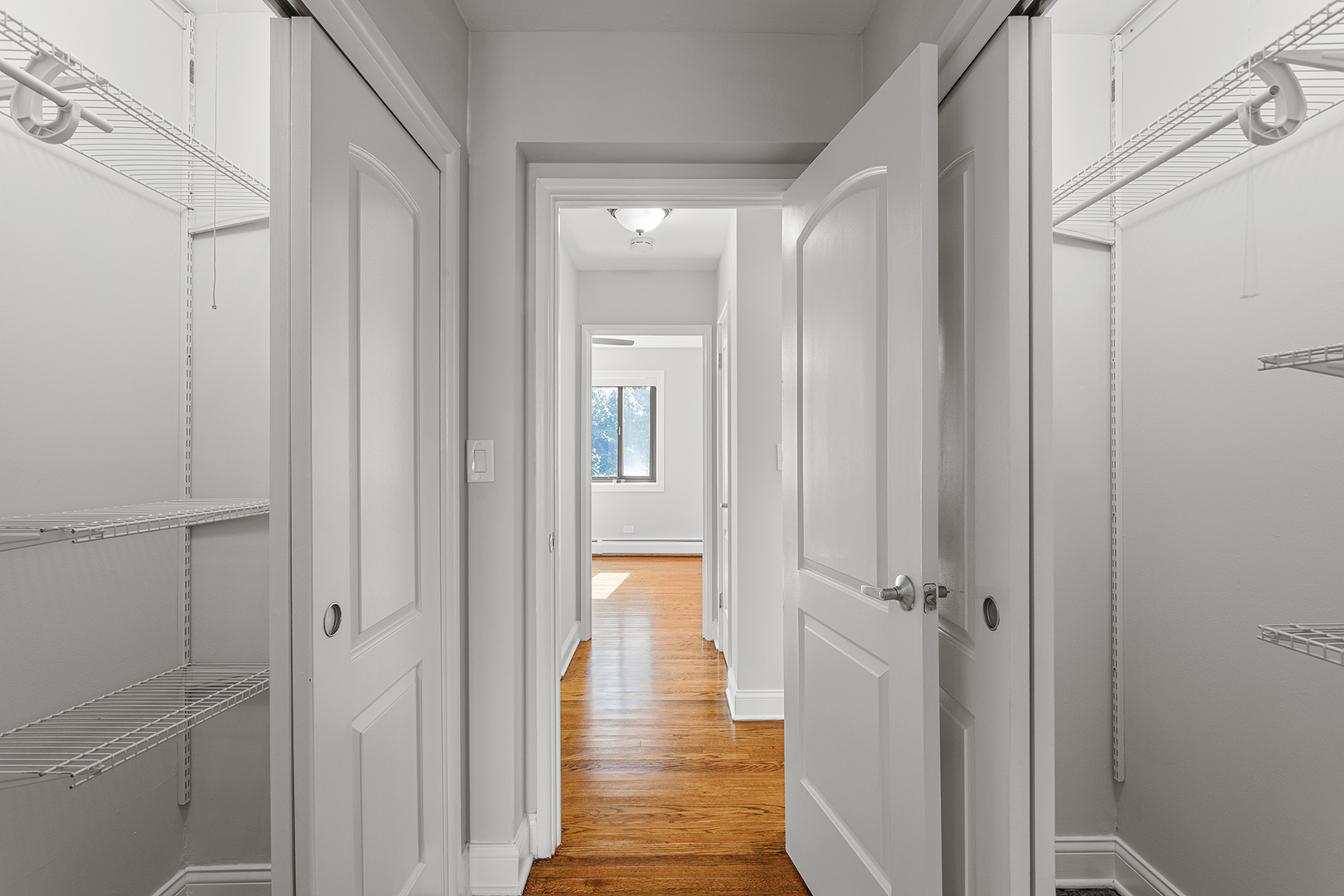 6826 North Ridge Boulevard, Unit 201 Chicago, IL 60645 - Photo 11 of 13 a view of a hallway with wooden floor and closet area