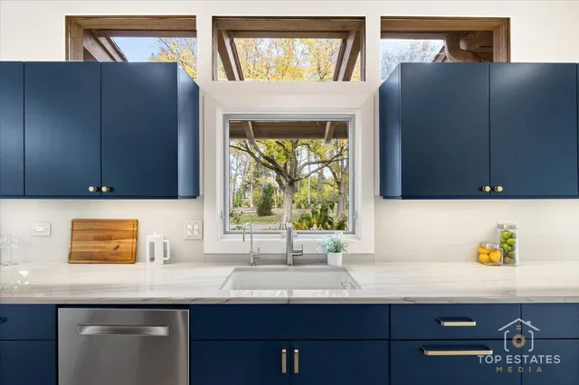 a kitchen with a sink and a window