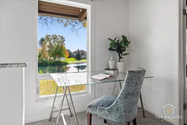 a dining room with furniture and a potted plant