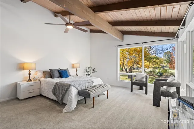 a bedroom with a bed and a table