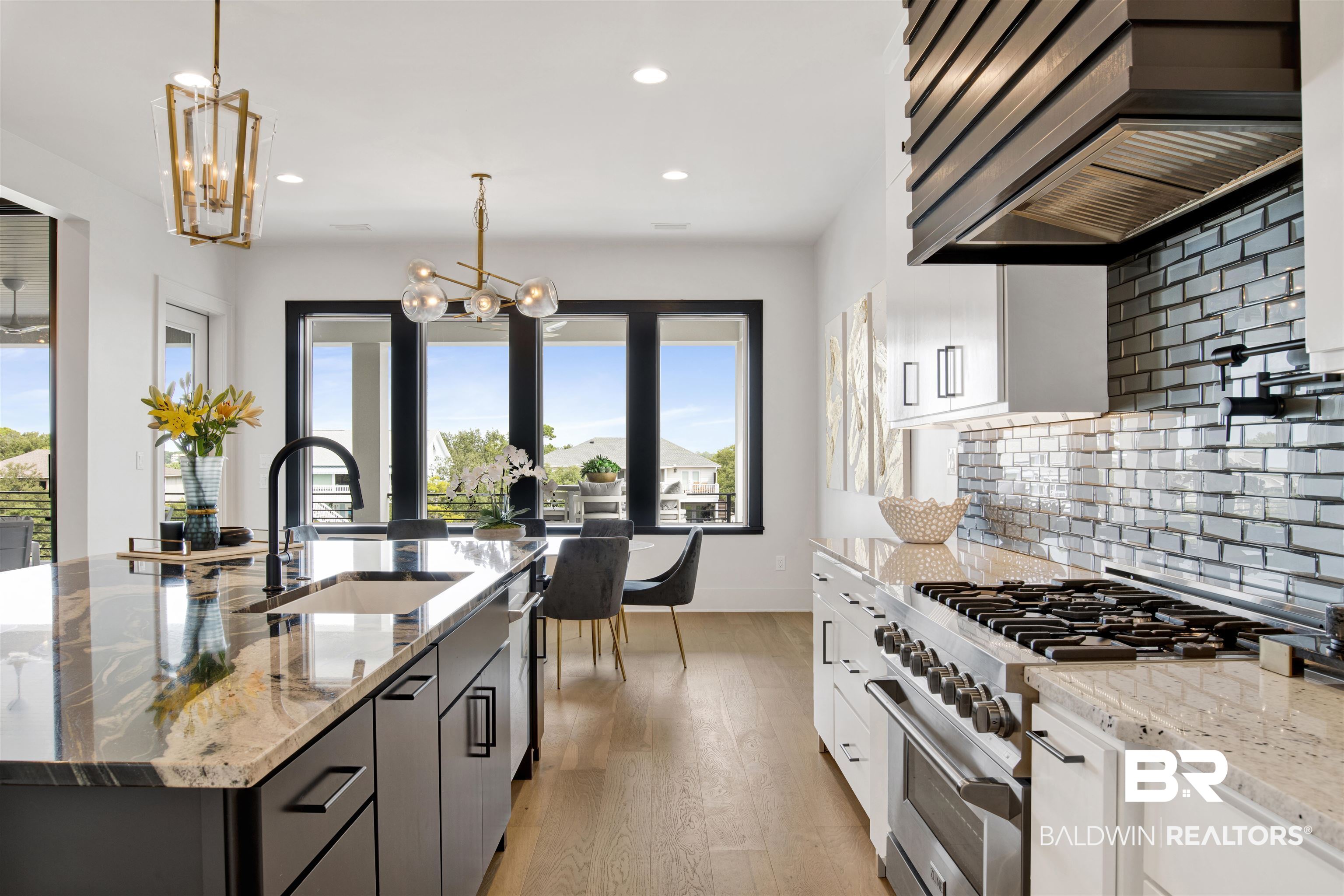 30239 Canal Court Orange Beach, AL 36561 - Photo 22 of 70 Kitchen featuring decorative light fixtures, high end range, custom exhaust hood, dark stone countertops, and recessed lighting